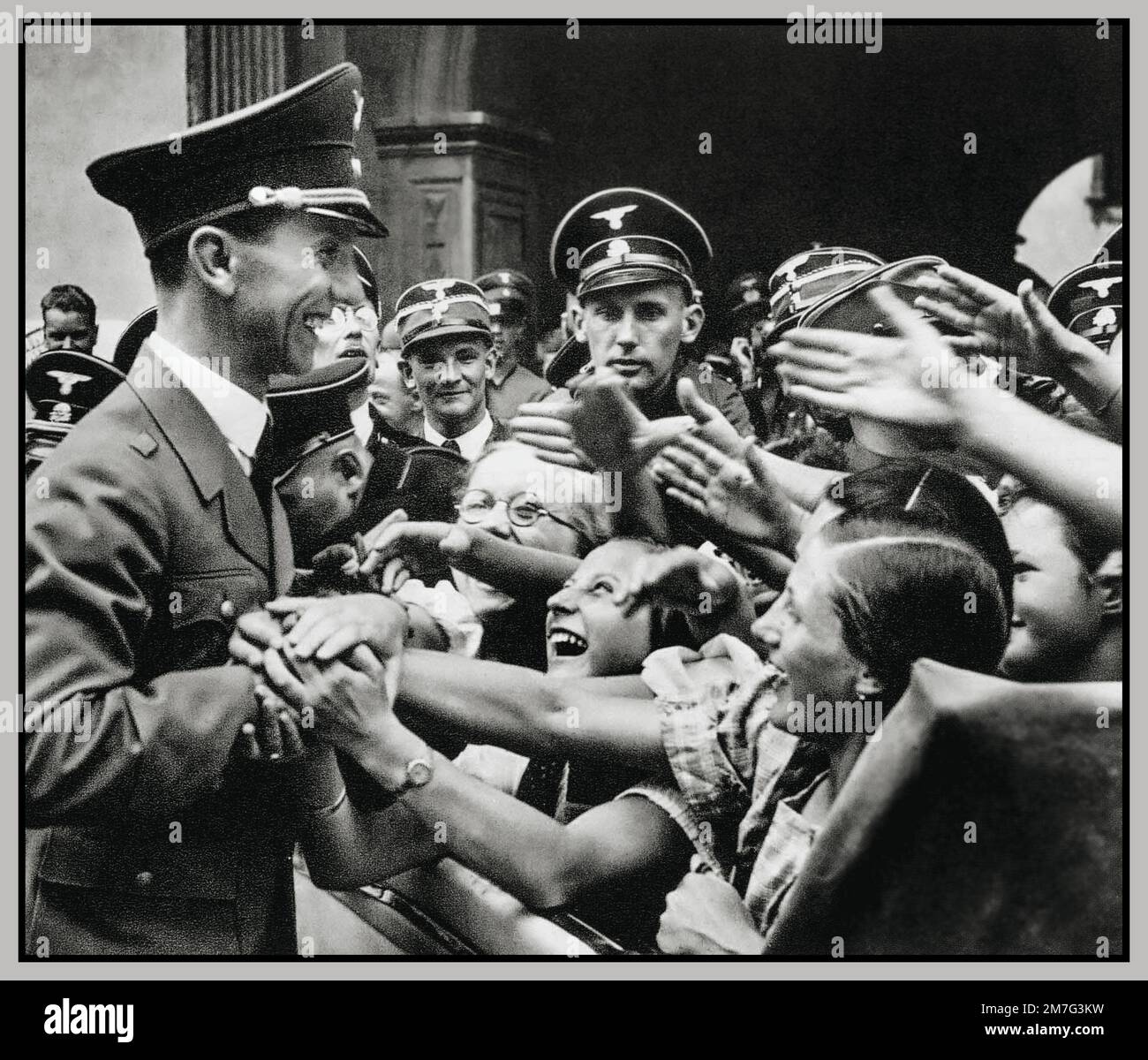 Joseph Goebbels Minister of Nazi propaganda in uniform with ecstatic female Nazi fans German Nazi politician who was the Gauleiter of Berlin, chief propagandist for the Nazi Party, and then Reich Minister of Propaganda from 1933 to 1945 1930s Nazi Germany Stock Photo