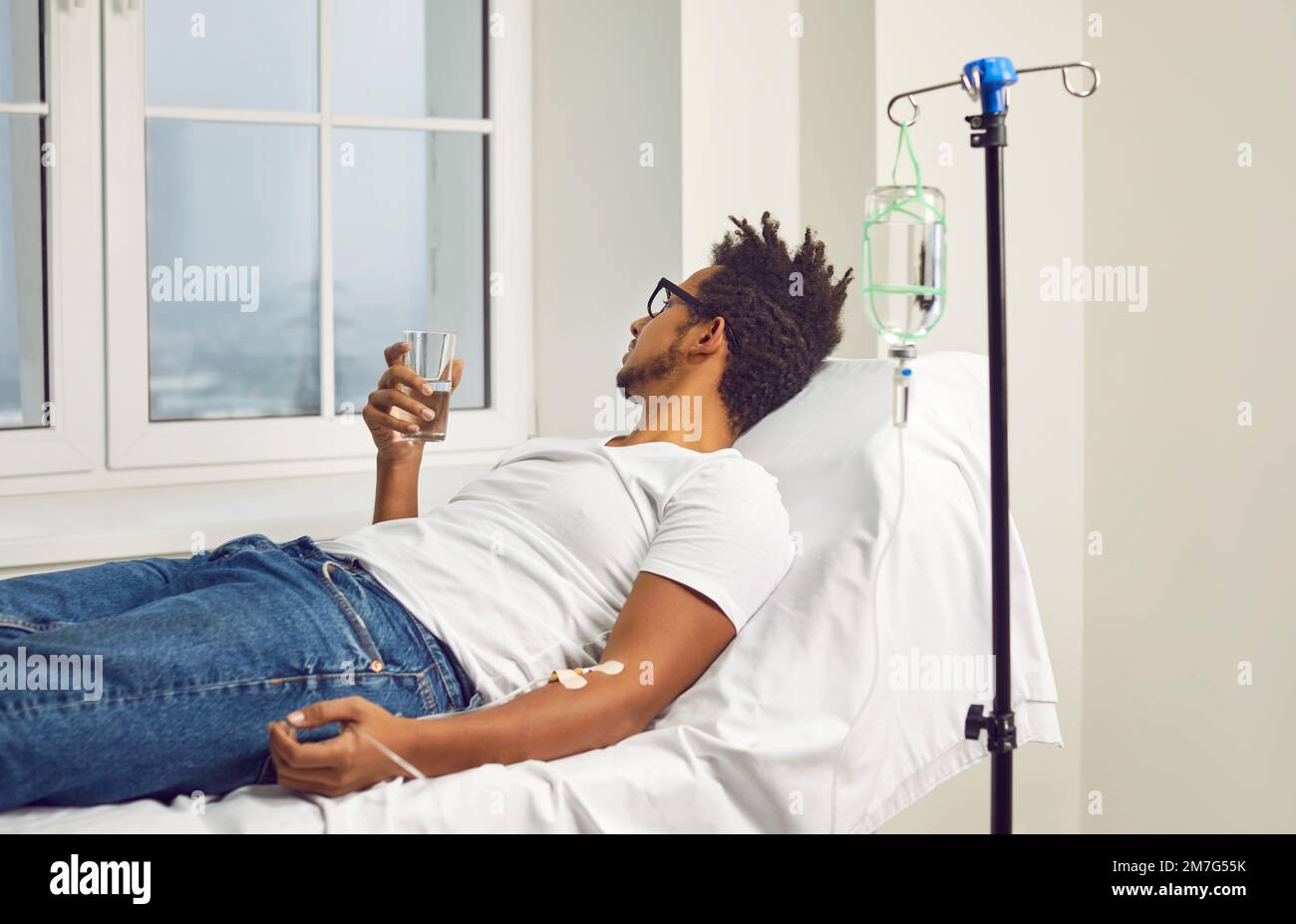 Man lying in hospital bed hi-res stock photography and images - Alamy