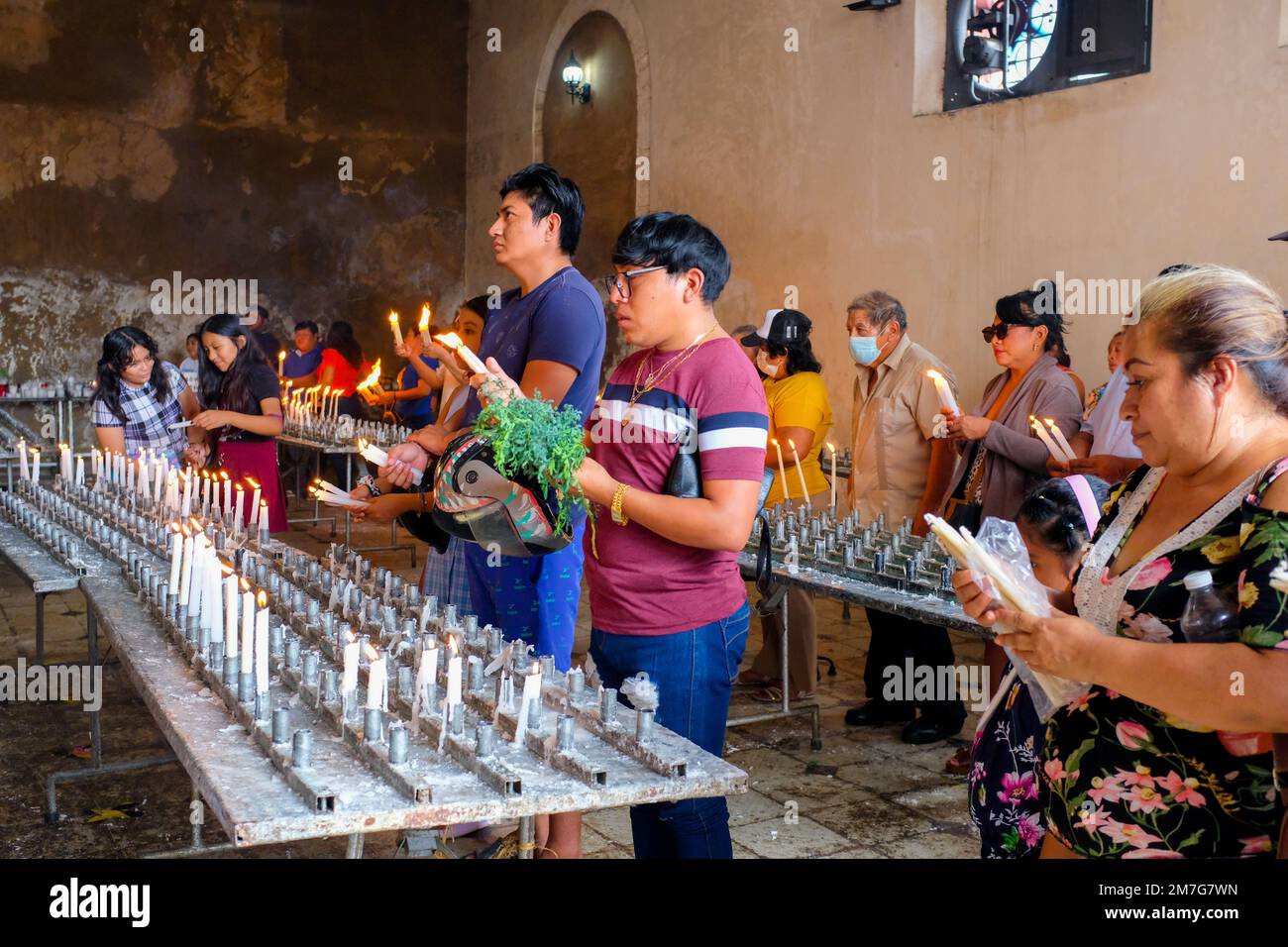 Mexican christian people praying at church during the Three Kings Day celebrations , Tizimin Yucatan Mexico Stock Photo