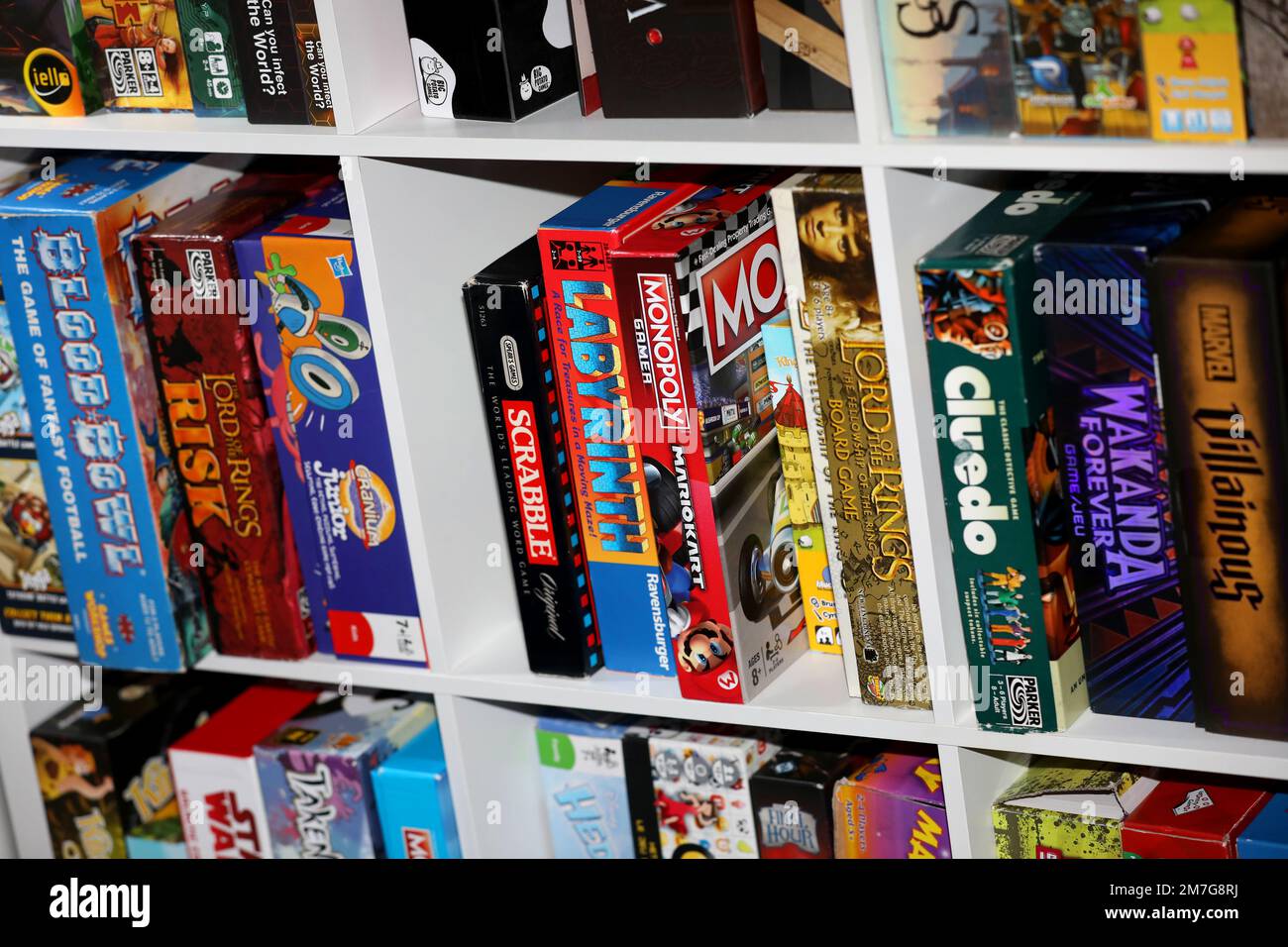 A shelf of board games on display to play in Havant, Hampshire, UK. Stock Photo