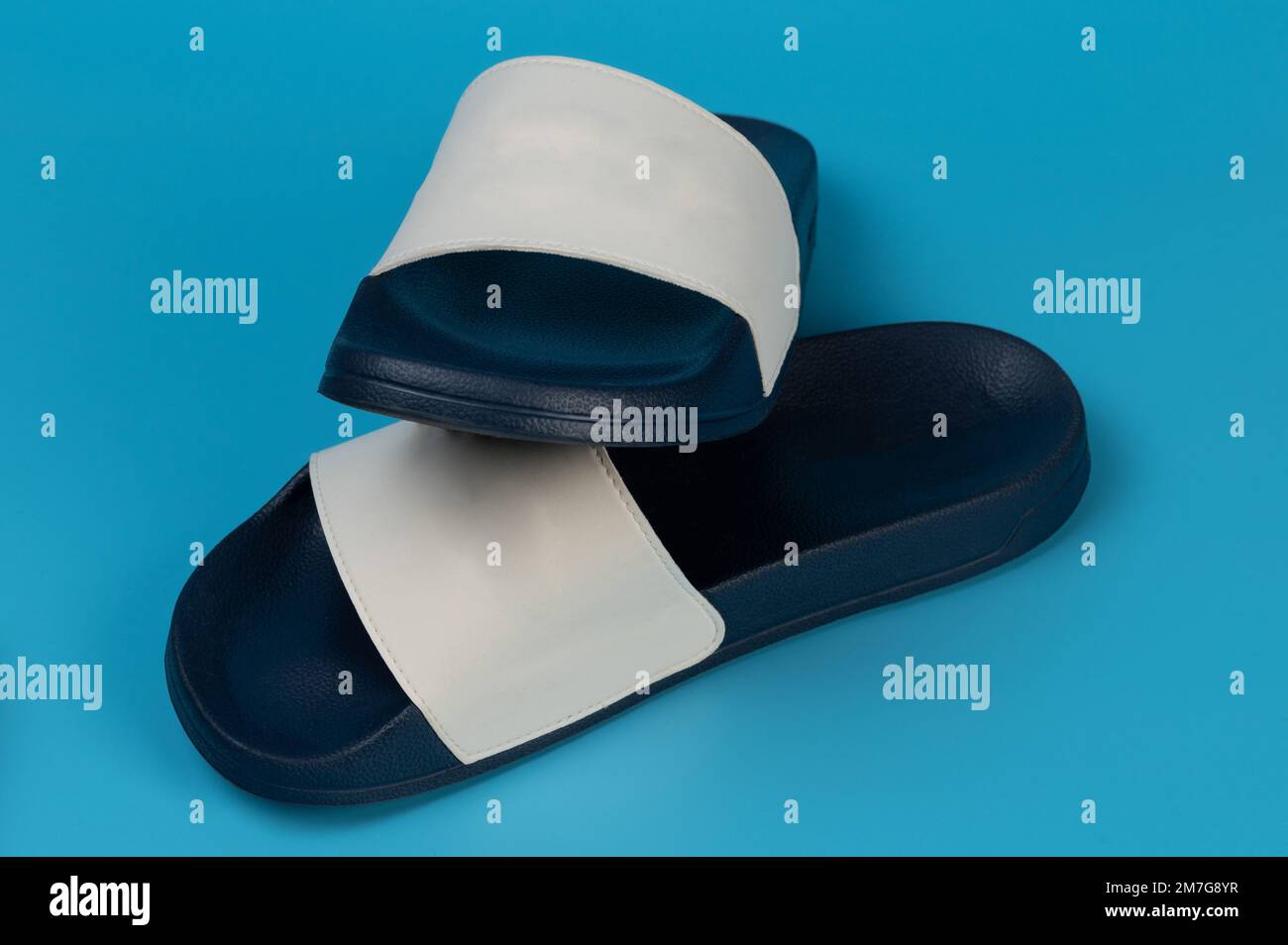 Elegant blue color slippers isolated on studio background perspective view Stock Photo