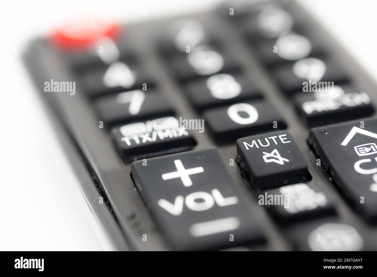 TV remote control with focus on volume and mute buttons, concept of deafness Stock Photo