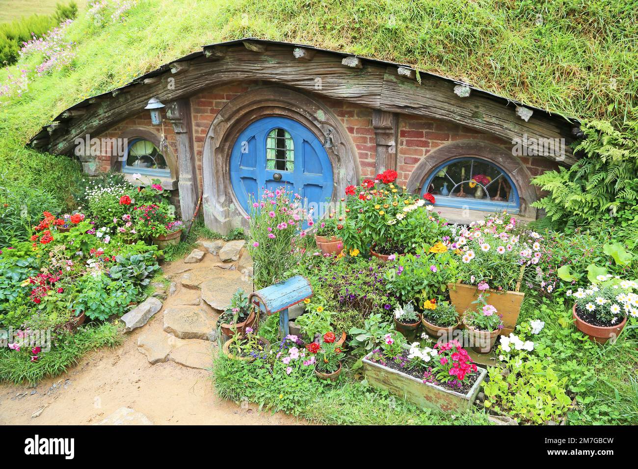 Hobbit house with blue door - Matamata, New Zealand Stock Photo
