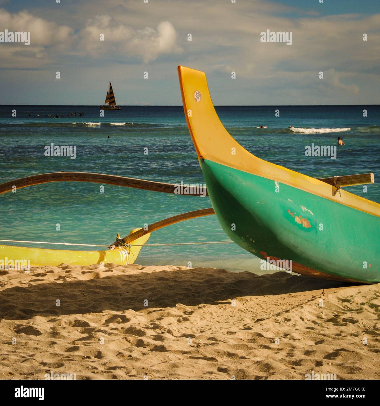 An outrigger canoe in the sand at Waikiki Beach, Oahu, Hawaii Stock Photo