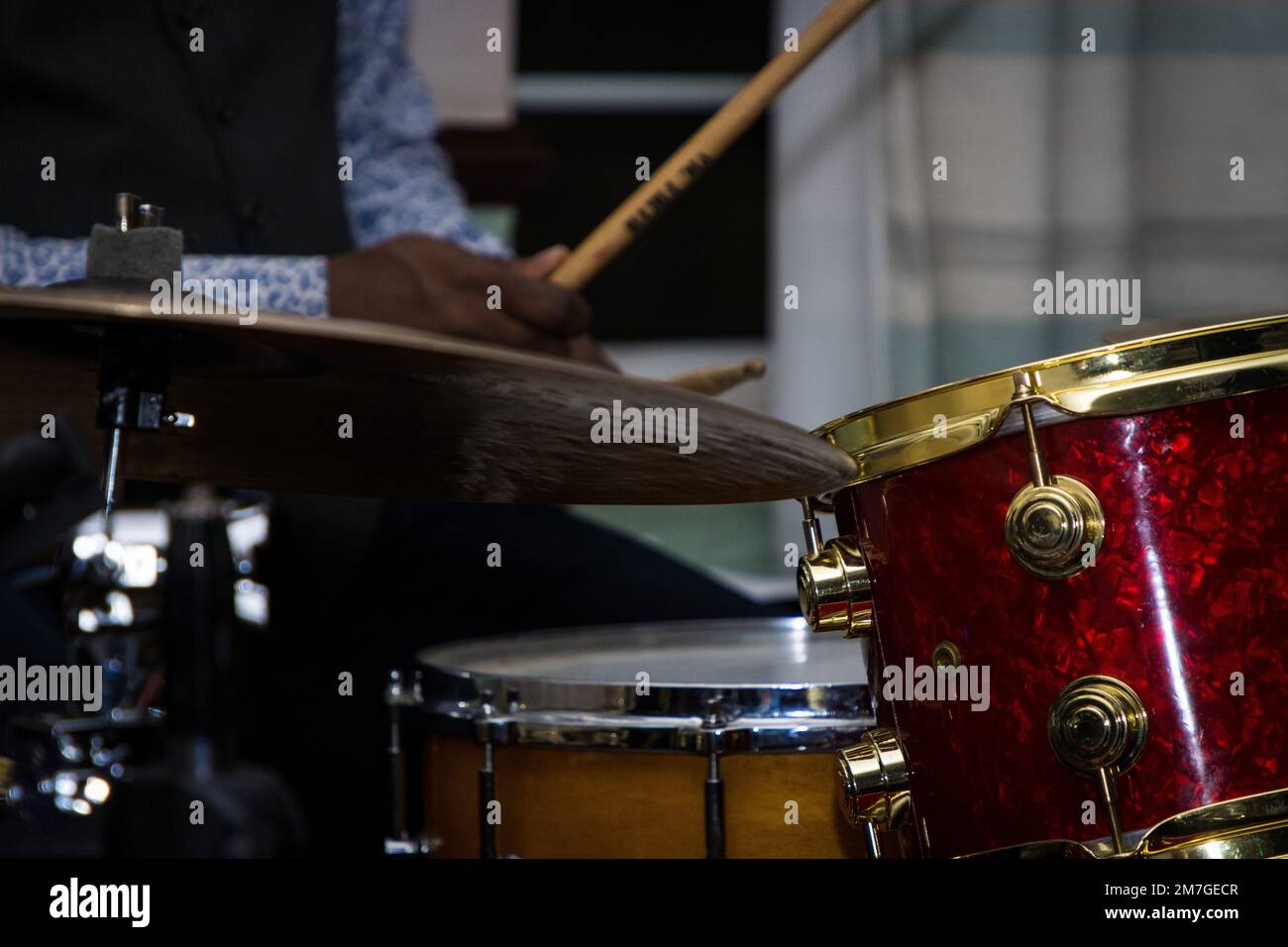 A closeup of a drummer playing a drum kit Stock Photo - Alamy
