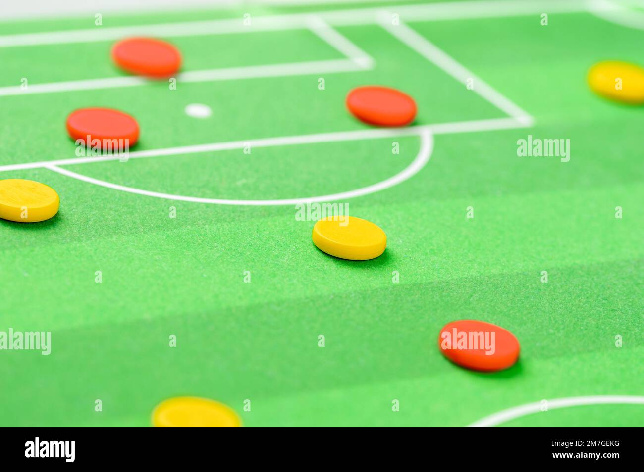 Closeup on a coach showing football players the line up on the field