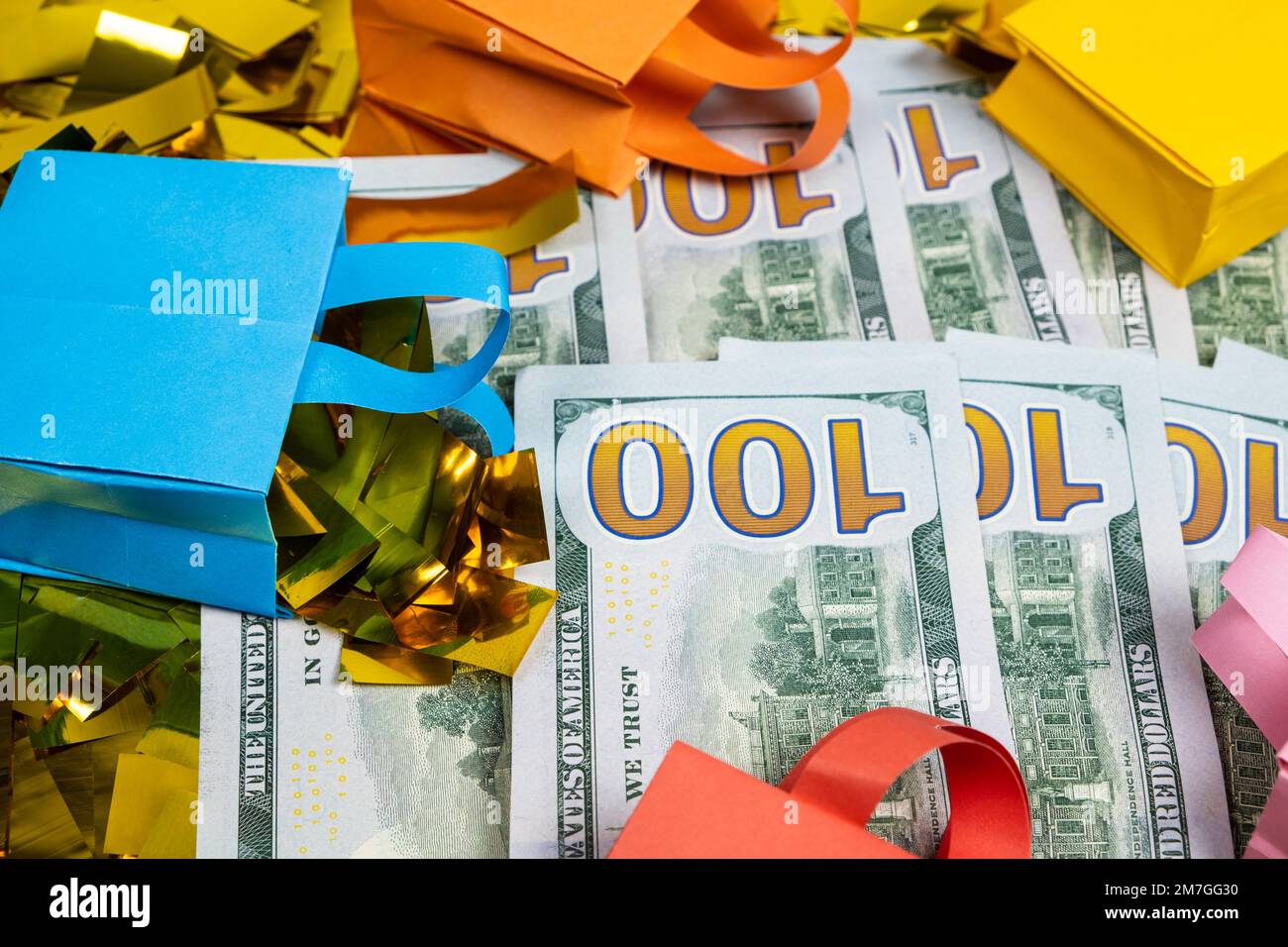 shopping-bags-and-a-money-hundred-dollar-bills-the-concept-of-sale