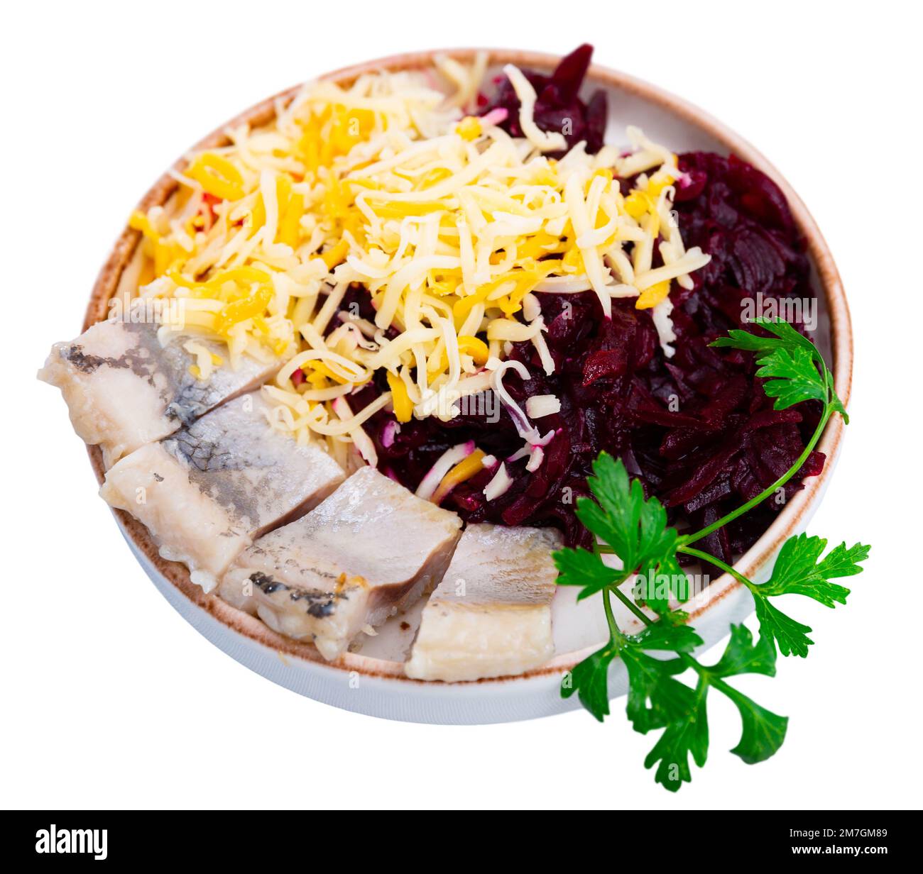 Sliced herring with grated beetroot and cheese served on table Stock Photo