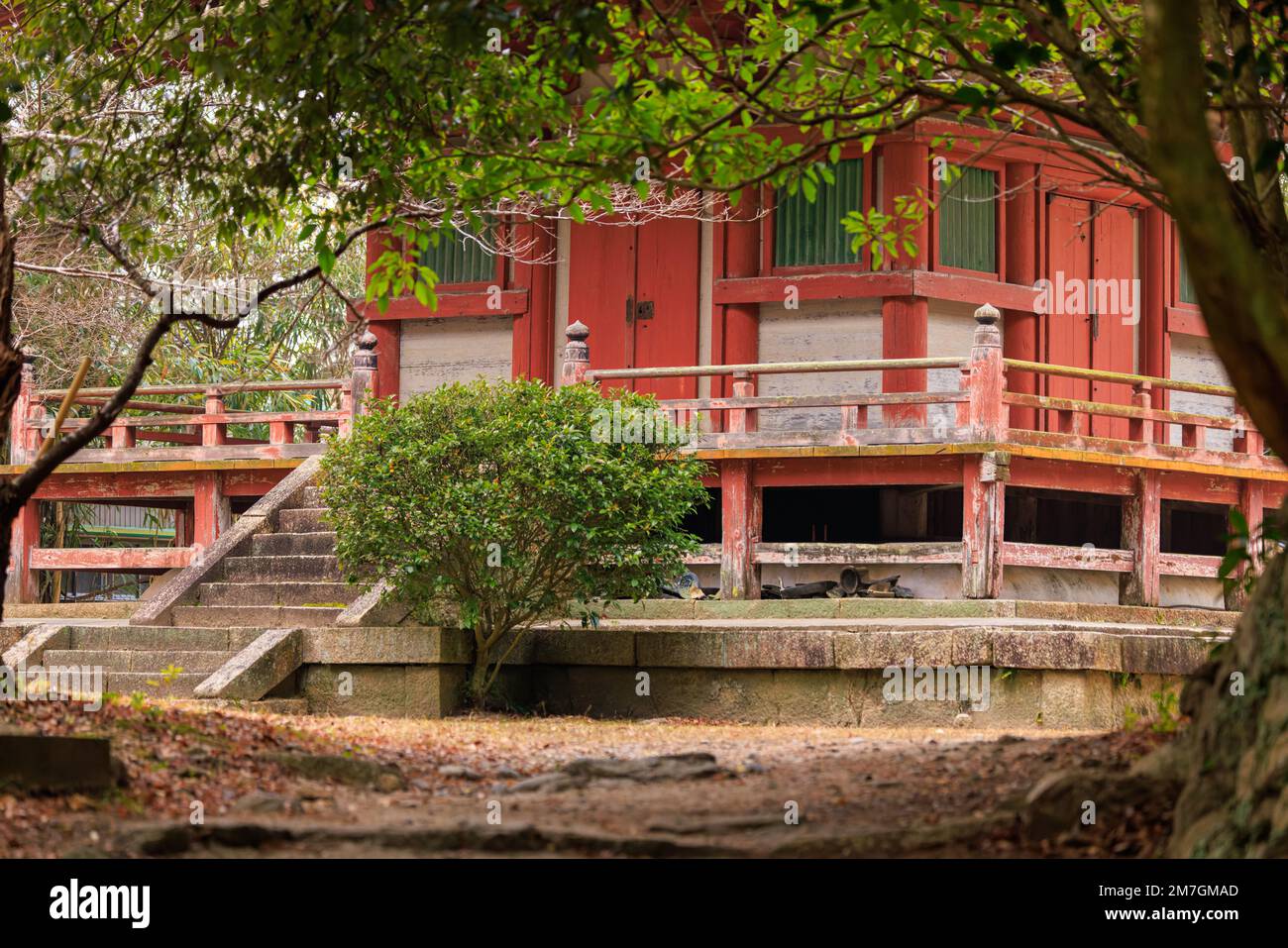 Small stairs and red building on natural grounds of Taisanji Temple Stock Photo