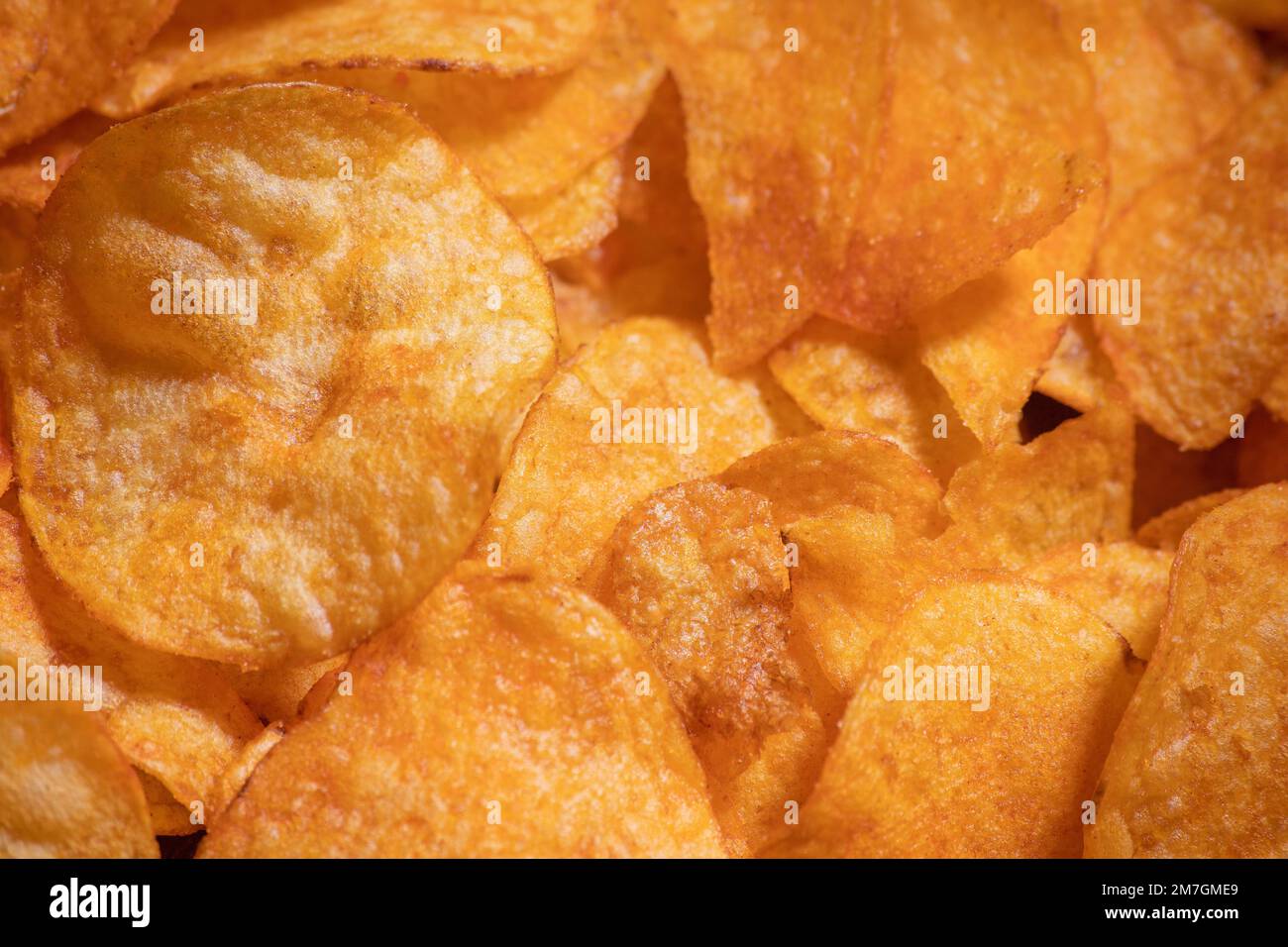 tasty crispy potato chips background Stock Photo