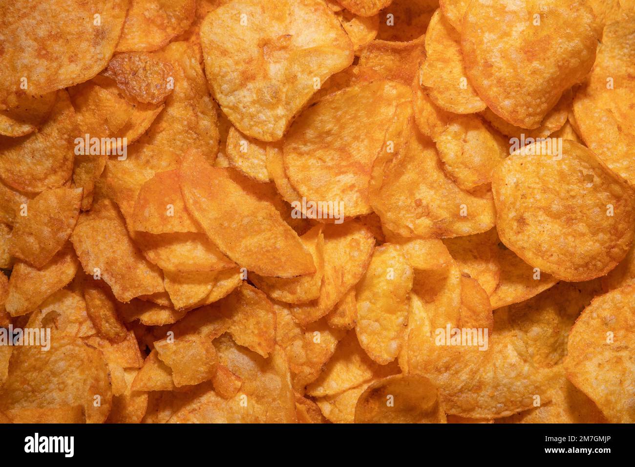tasty crispy potato chips background Stock Photo