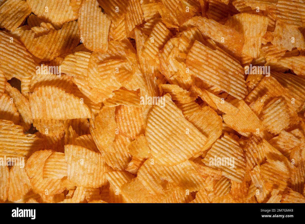 tasty crispy potato chips background Stock Photo