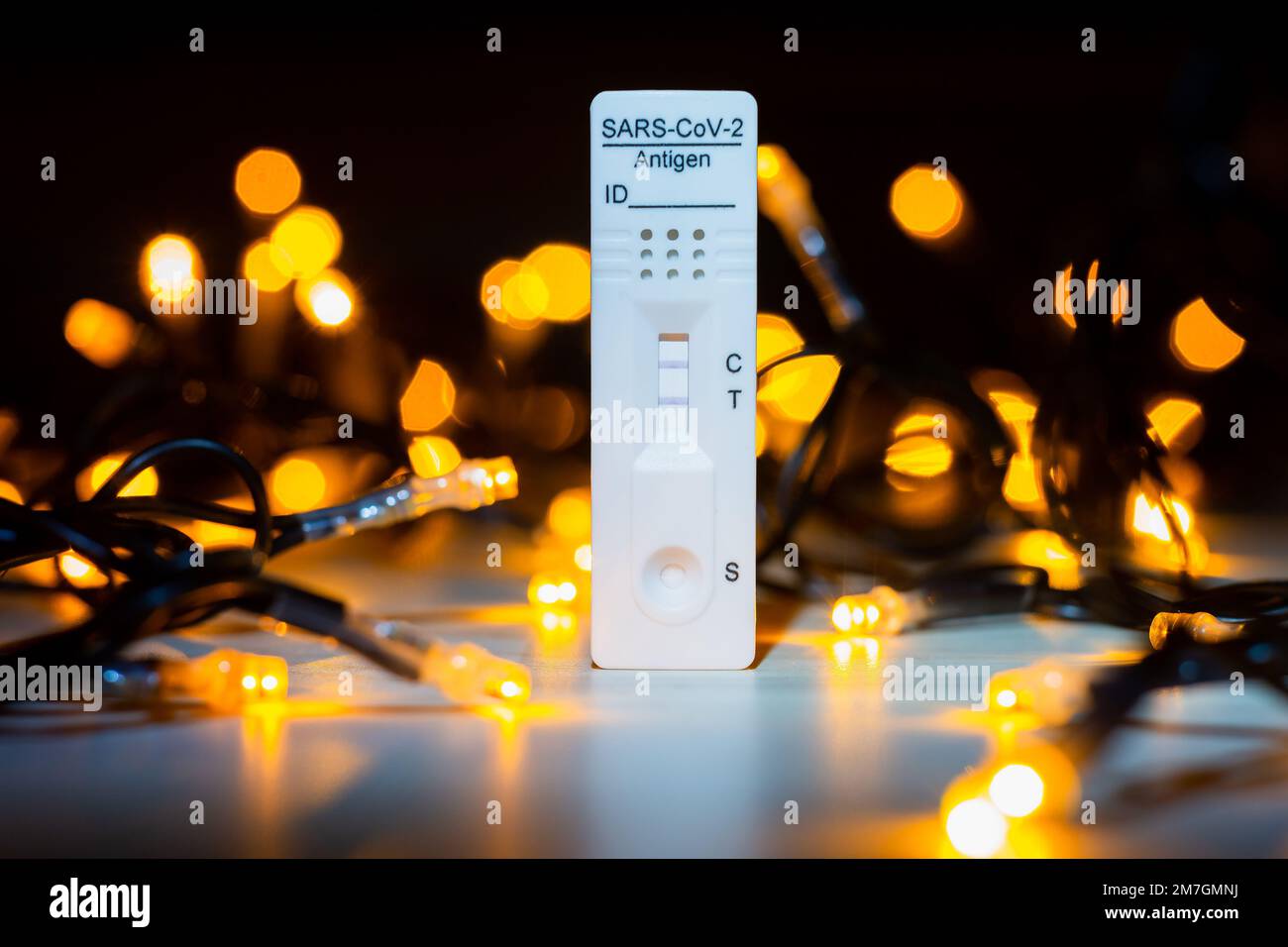 Positive corona test with a Christmas lights in a background Stock