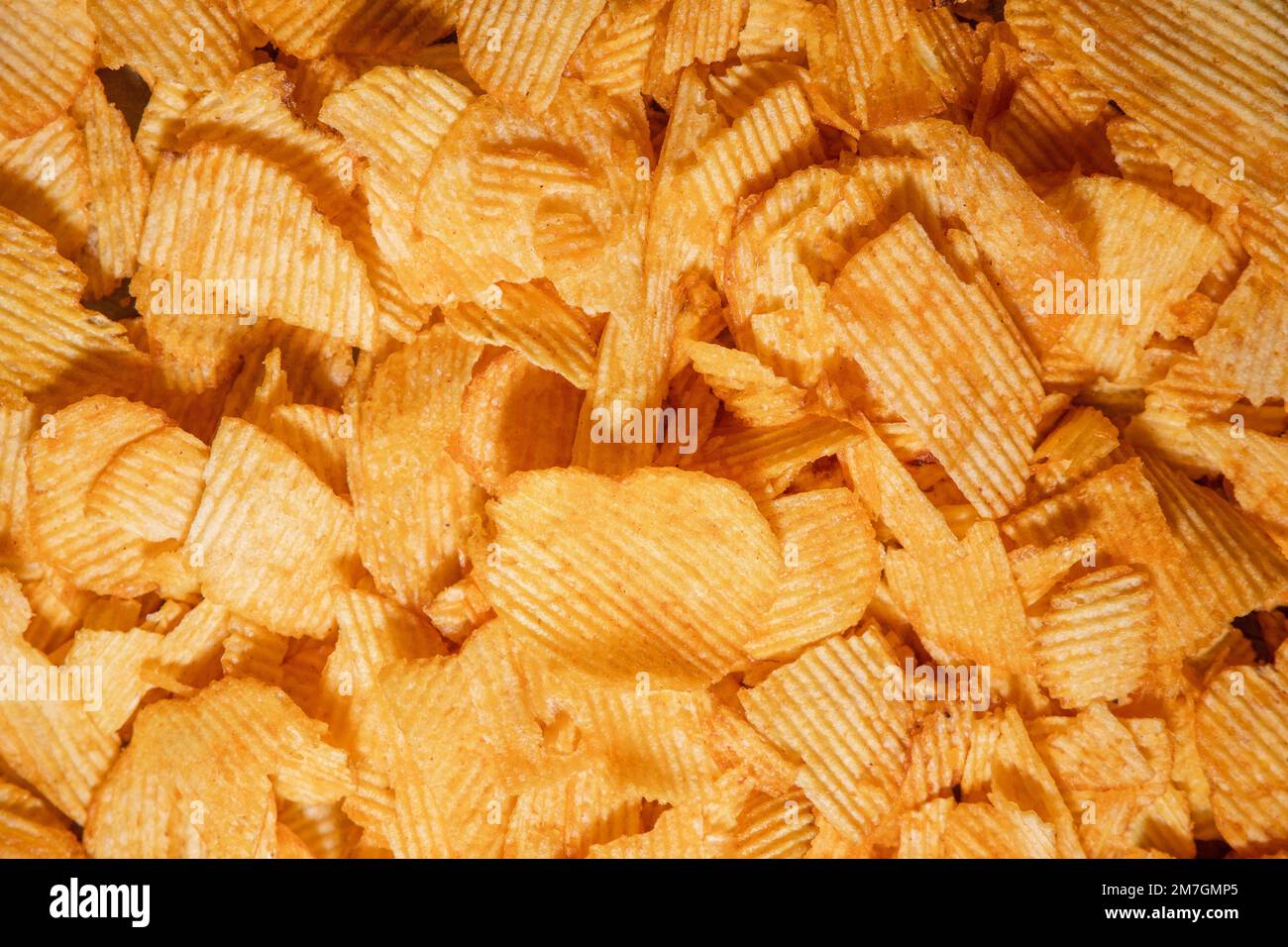 tasty crispy potato chips background Stock Photo