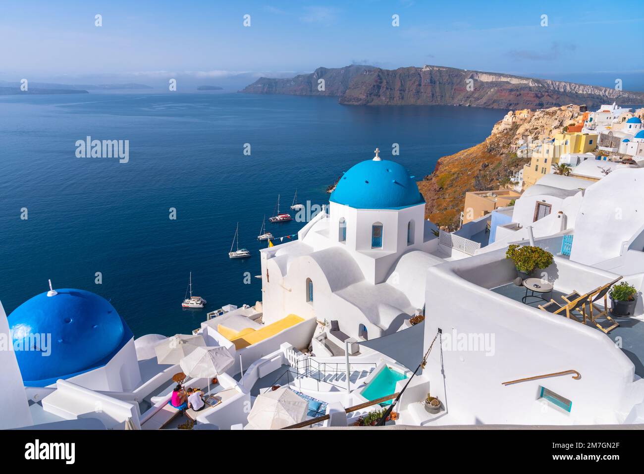 Santorini island, Greece. Traditional and famous houses and churches with blue domes over the Caldera, Aegean sea Stock Photo