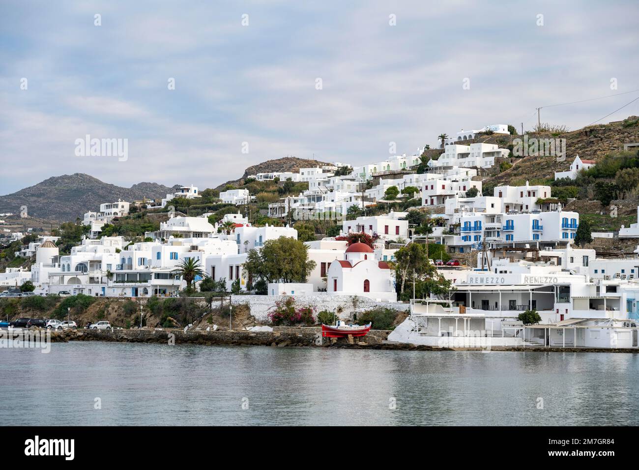 White Cycladic houses on the coast, Greek Orthodox Church by the sea, Holy Church of Rodon and Amaranto, Mykonos Town, Mykonos, Cyclades, Greece Stock Photo