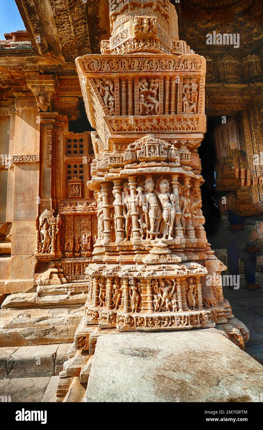 A vertical shot of a unique column with many curved sculptures in Khajuraho complex India Stock Photo