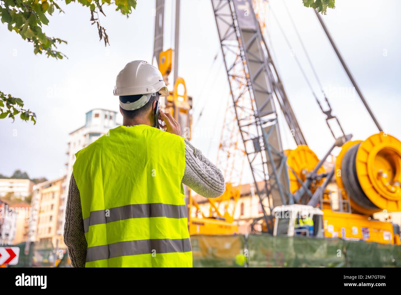 Technician engineer observing the team of workers at the construction ...