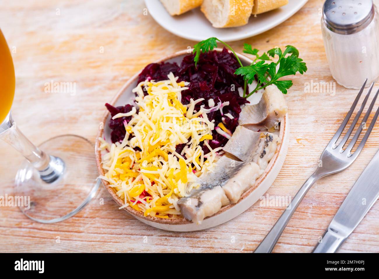Beetroot served with cheese and pickled mackerel Stock Photo