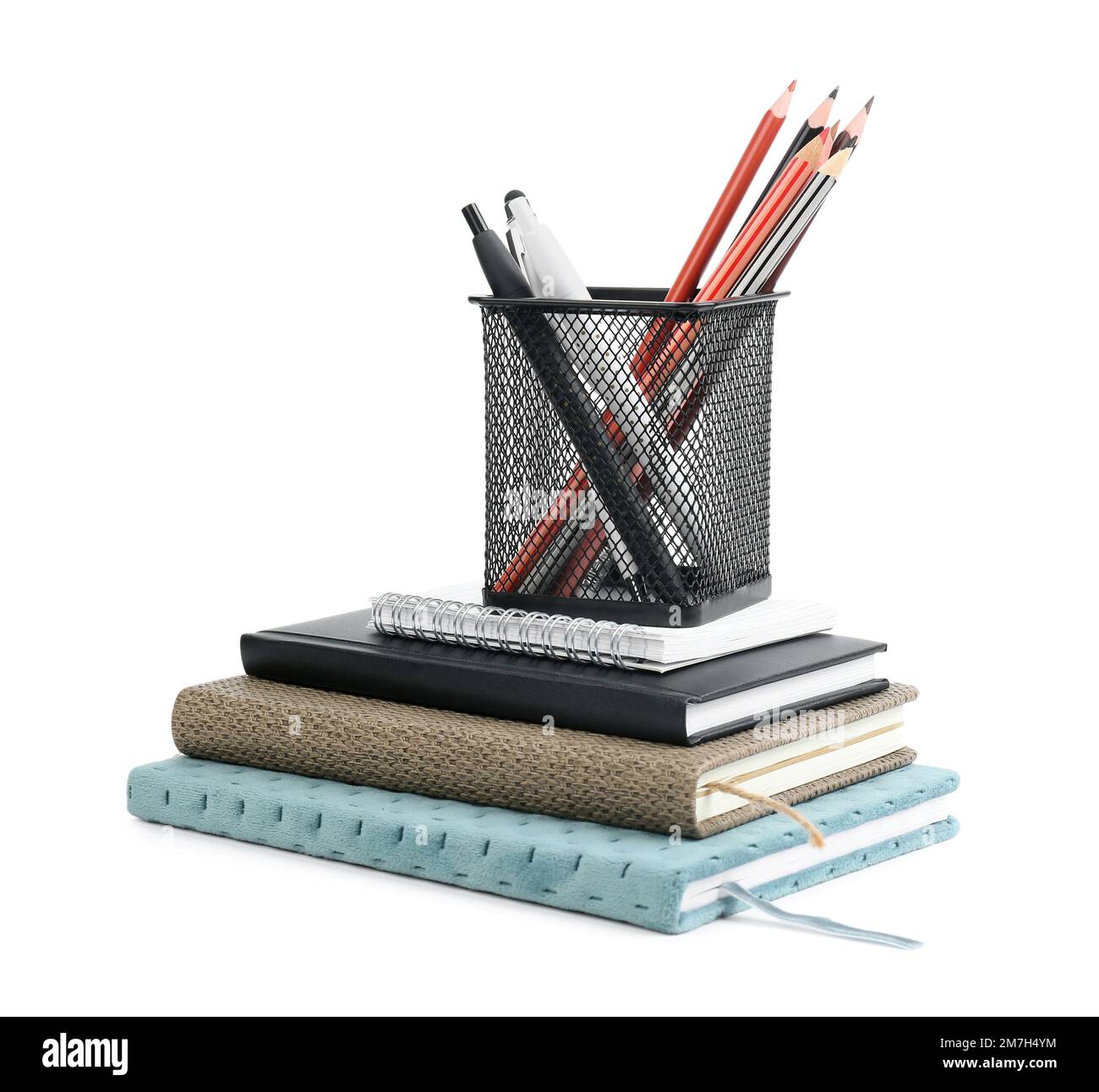 Stationery holder with notebooks on white background Stock Photo - Alamy
