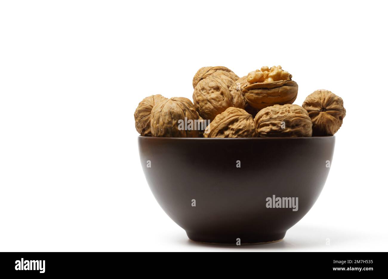 walnuts in a brown bowl Stock Photo