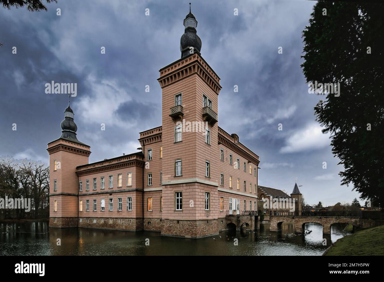 Liblar, Germany, January 09 2023: the historic moated castle Gracht in erftstadt at dusk Stock Photo