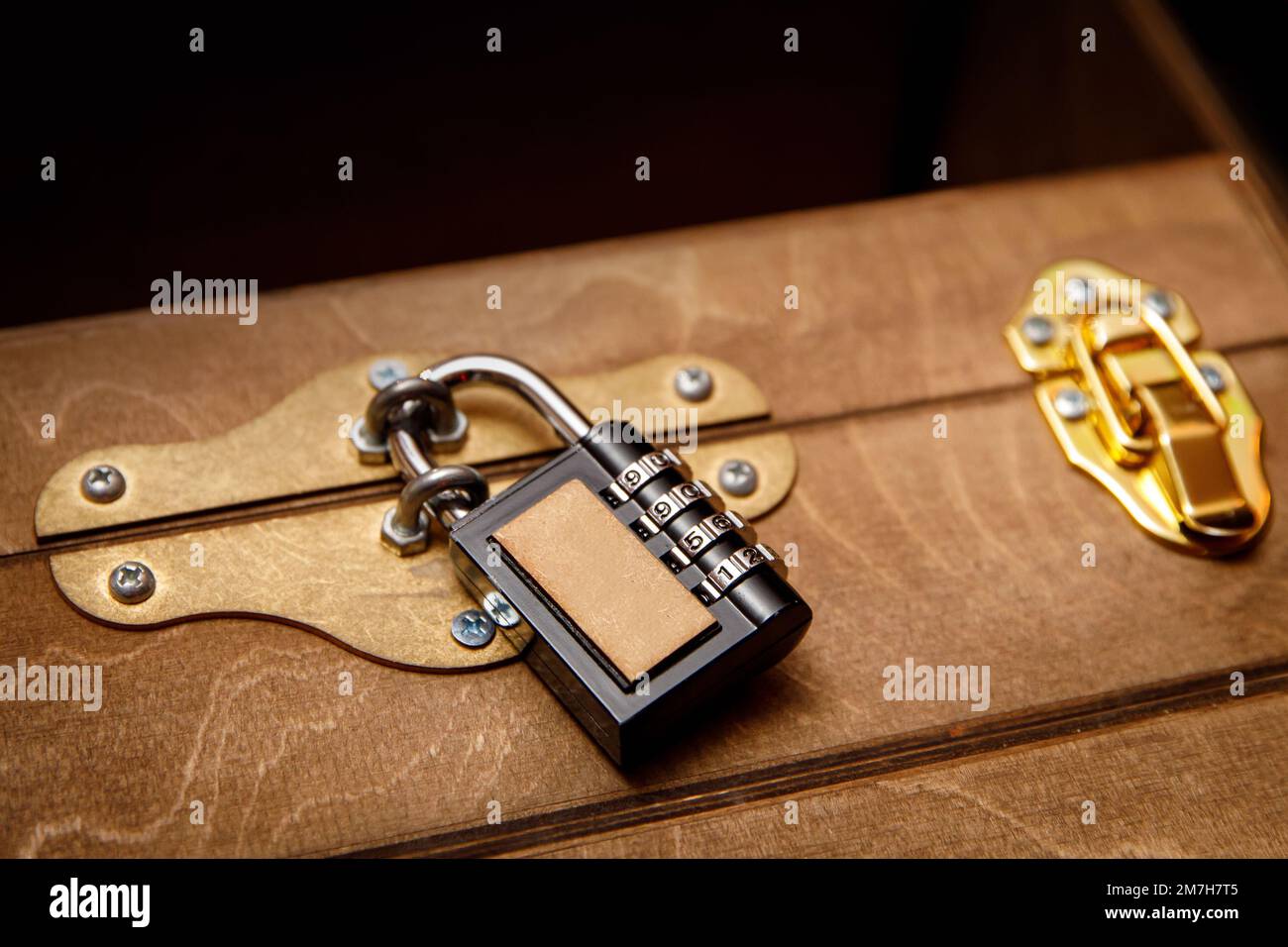Combination lock on the old chest Stock Photo Alamy