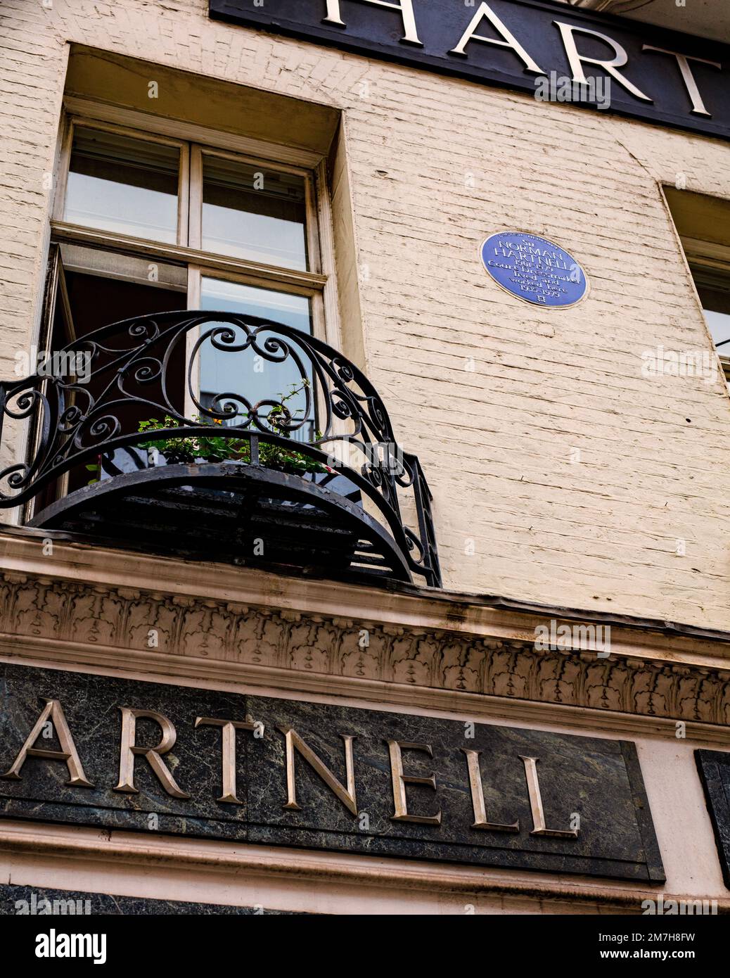 English Heritage blue plaque for Norman Hartnell, fashion designer, in