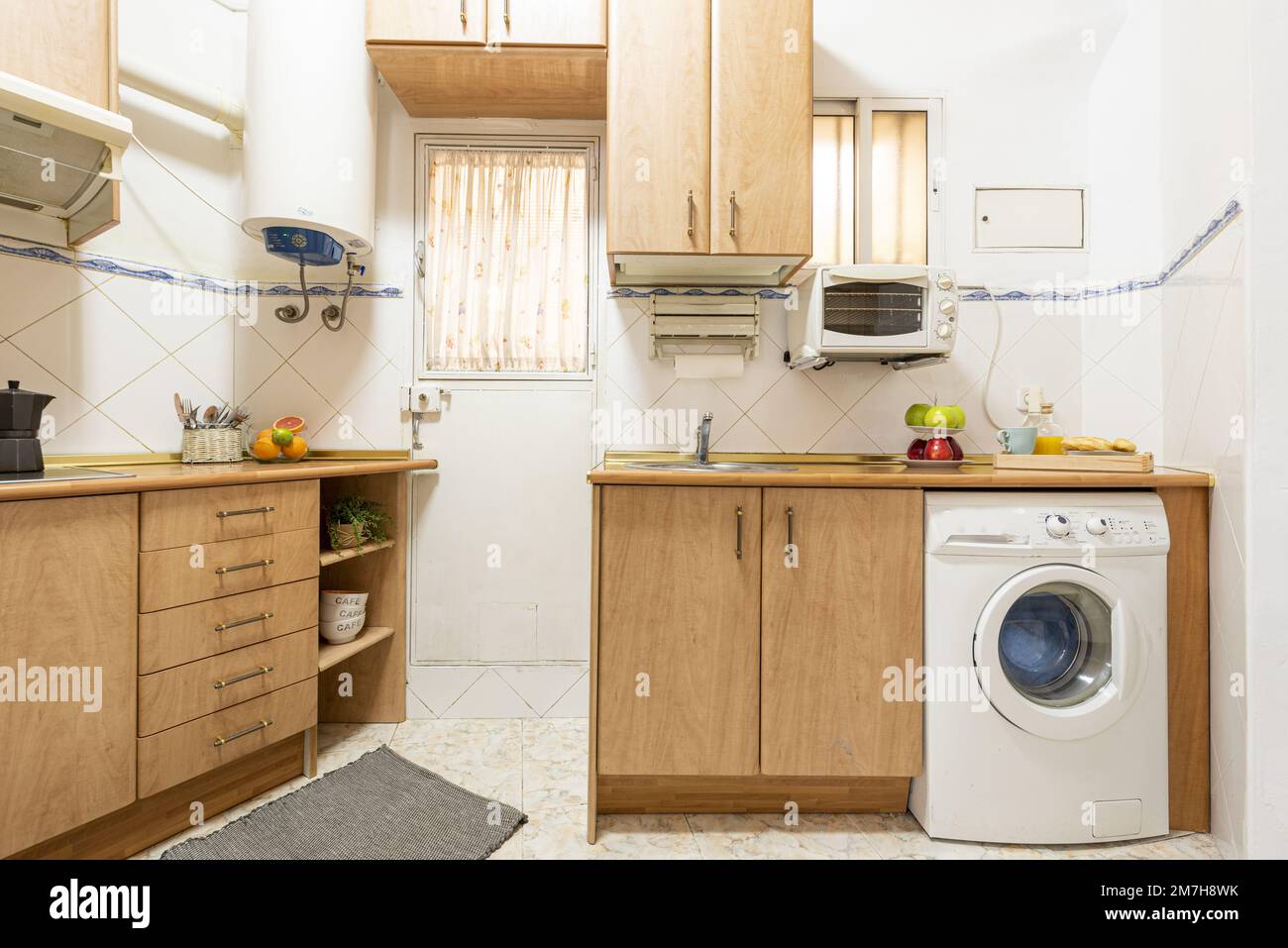 Conventional kitchen with light wood with white builtin