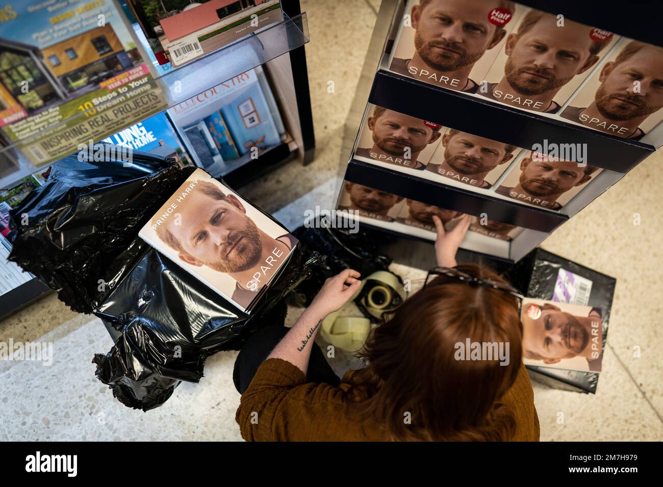 The newly released autobiography from the Duke of Sussex on dipslay at WHSmith's in Victoria Station, London, where the book became available to purchase at midnight. Picture date: Tuesday January 10, 2023. Stock Photo