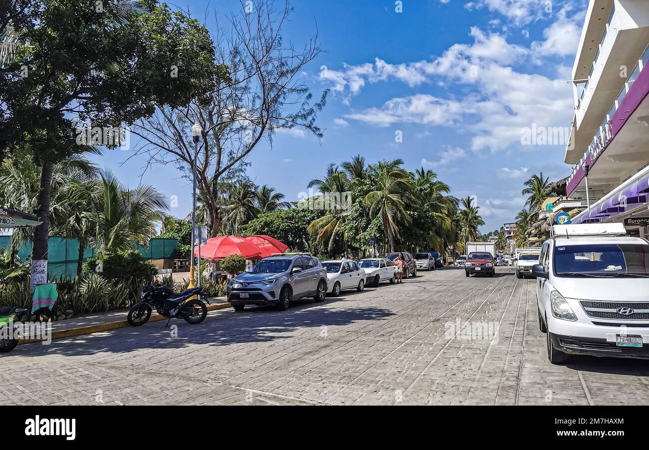 Colorful streets cars high traffic stores people buildings and trade in ...