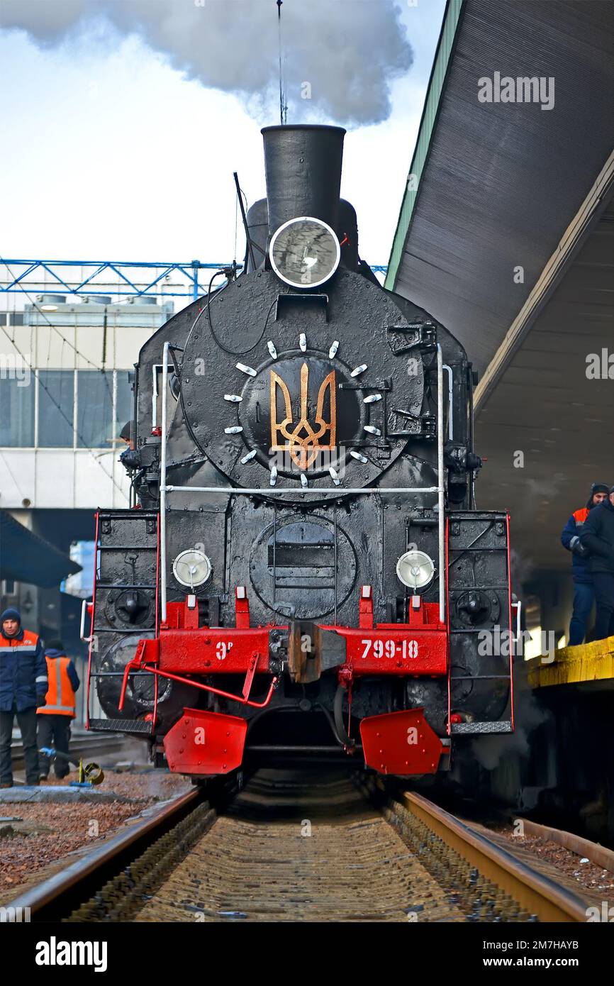 Christmas express with retro steam locomotive ER-799-18 arriving to the Central Railway Station on January 07, 2023 in Kiev, Ukraine. Stock Photo