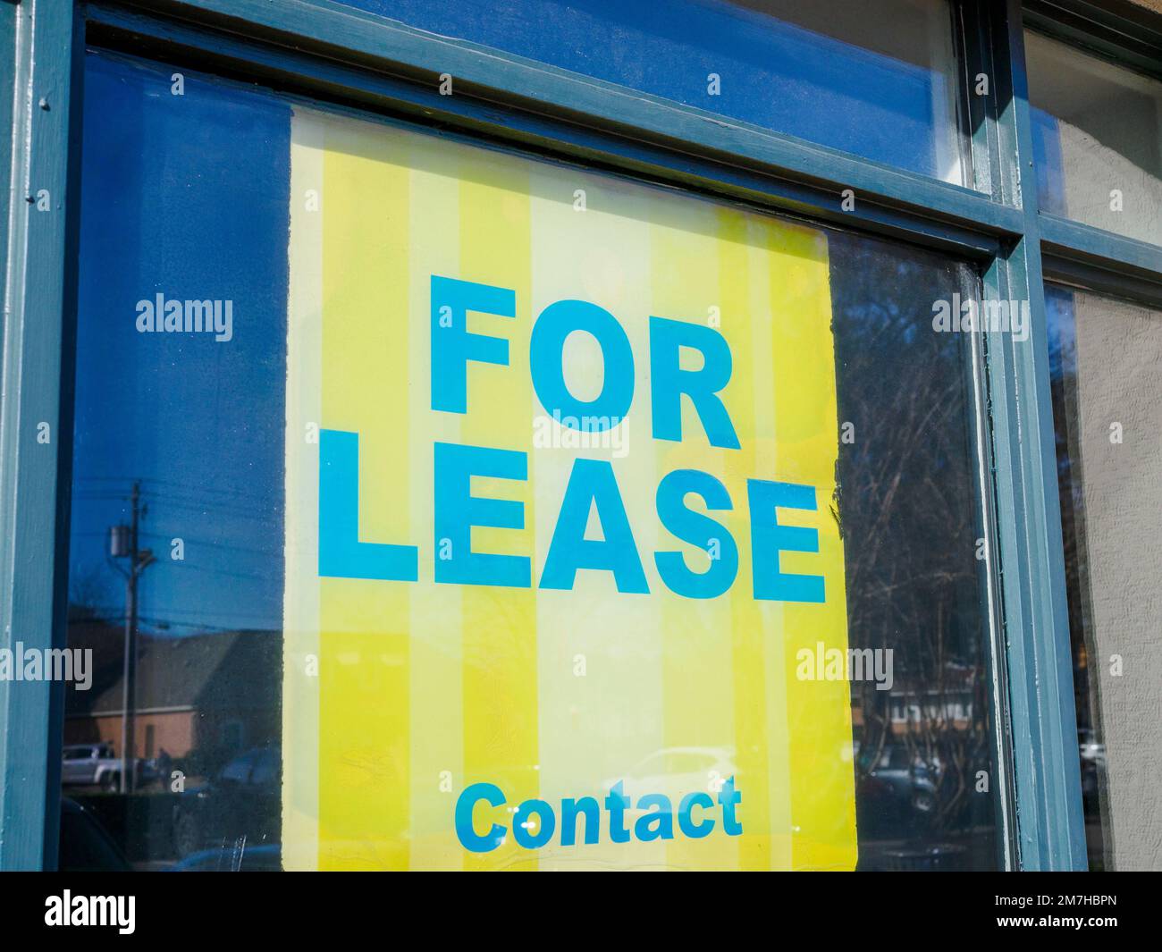 For lease real estate space sign in the window of local small business space, indicating a business slow down in Montgomery Alabama, USA. Stock Photo