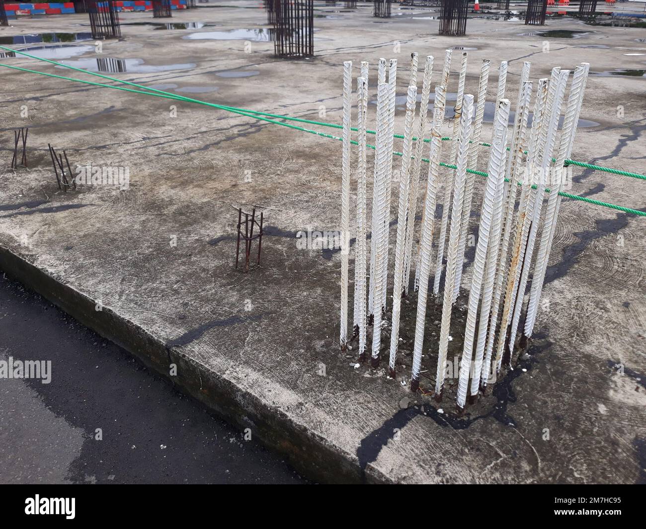 Remaining iron rod steel foundation of the second floor building construction Stock Photo