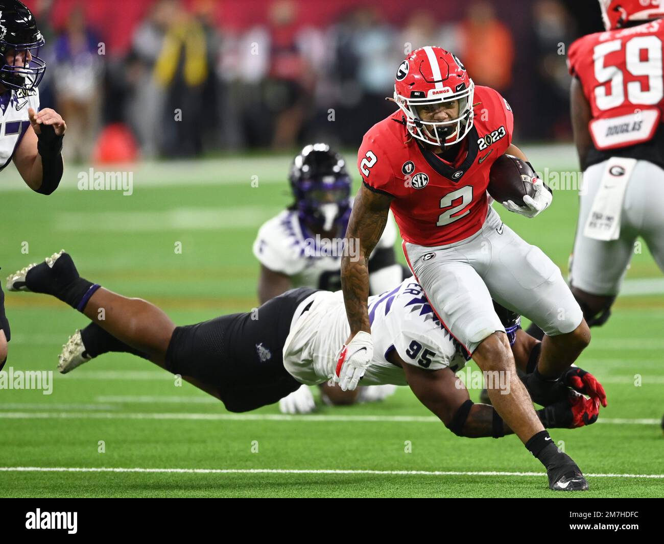 Inglewood, United States. 09th Jan, 2023. Georgia Bulldogs runningback Kendall Milton carries the football in the first quarter against the TCU Horned Frogs at the 2023 NCAA College Football National Championship between Georgia and TCU at SoFi Stadium in Inglewood, California, on Monday, January 9, 2023. Photo by Mike Goulding/UPI Credit: UPI/Alamy Live News Stock Photo