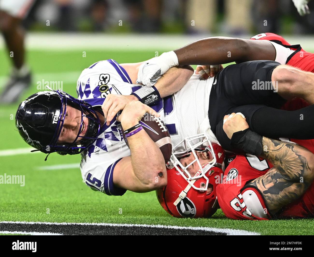 Inglewood, United States. 09th Jan, 2023. TCU Horned Frogs Max Duggan is tackled after a short gain in the second quarter at the 2023 NCAA College Football National Championship between Georgia and TCU at SoFi Stadium in Inglewood, California, on Monday, January 9, 2023. Photo by Mike Goulding/UPI Credit: UPI/Alamy Live News Stock Photo