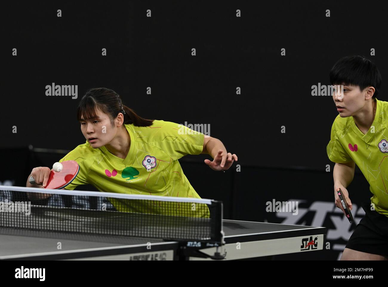 Doha, Qatar. 9th Jan, 2023. Cheng I-Ching/Li Yu-Jhun (L) of Chinese Taipei  compete against Goi Rui Xuan/Wong Xin Ru of Singapore during the women's  doubles round of 16 match of World Table