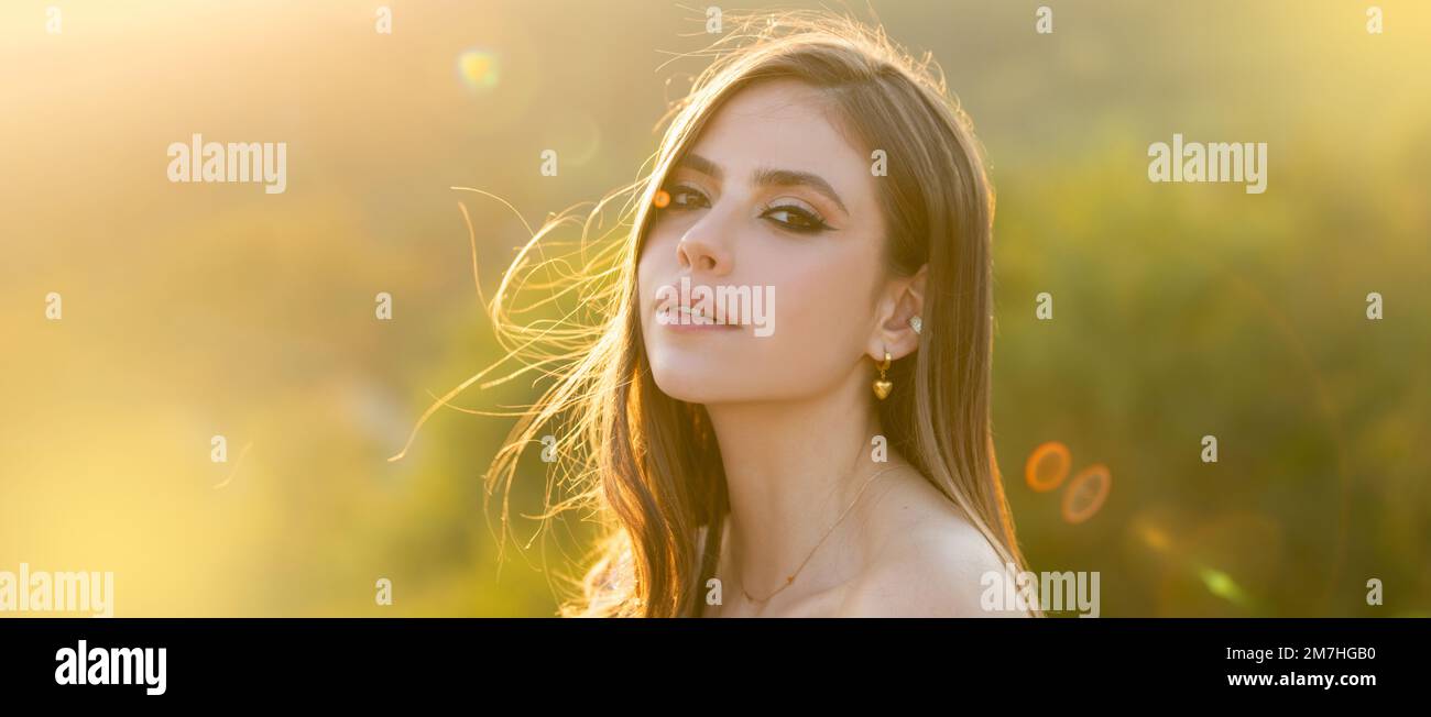 Spring woman on sunlight romantic portrait, sensual sunny face. Banner
