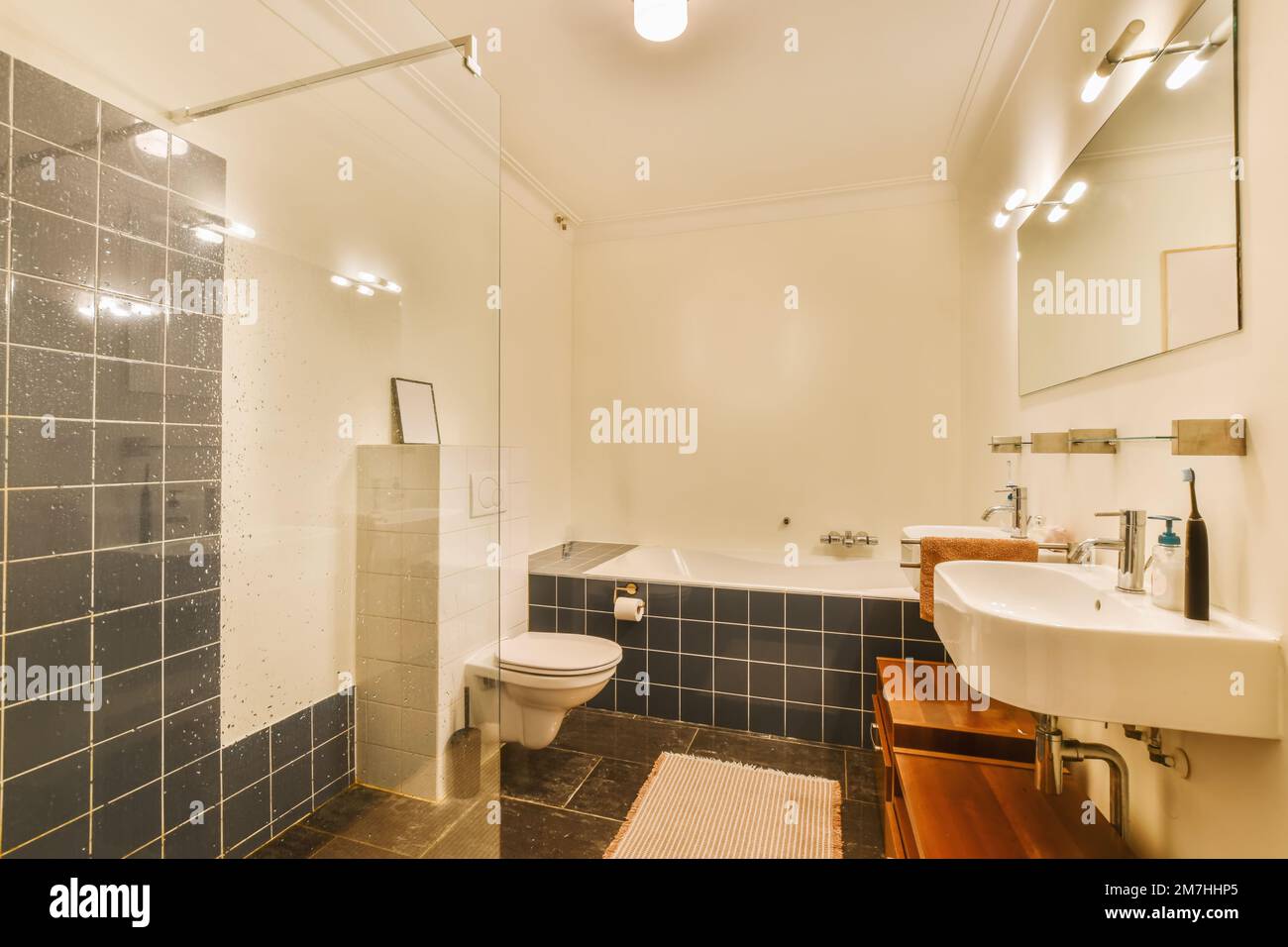 a bathroom that is very clean and ready to be used as a shower stall or room for the people who use it Stock Photo