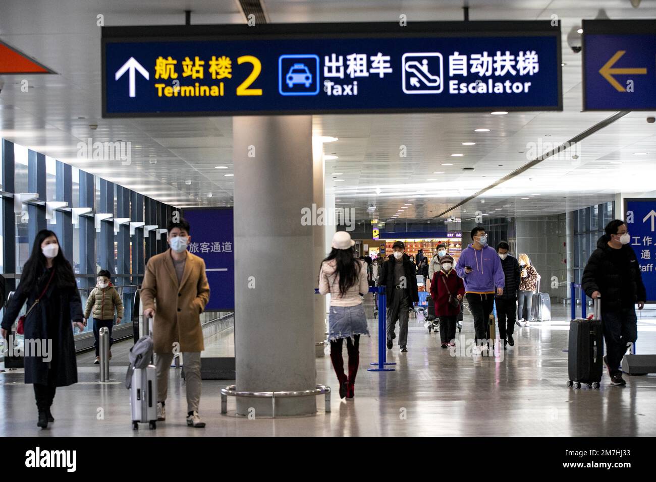 Inbound passengers walk out of the entry passage in the international