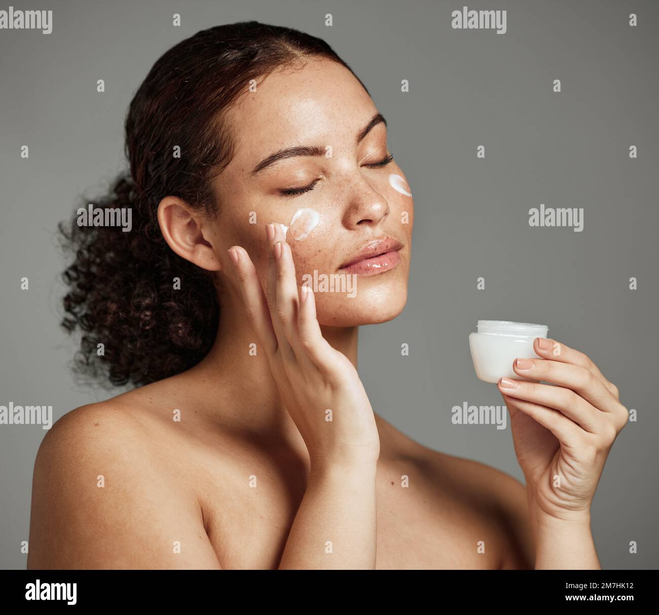 Black woman, face and skincare cream for beauty wellness shine