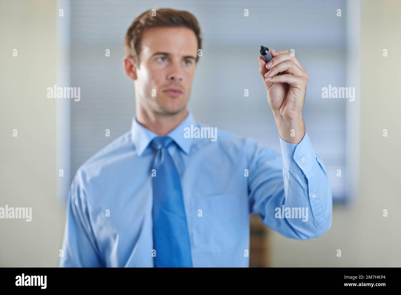 Touching the future. a handsome young businessman using a digital interface. Stock Photo