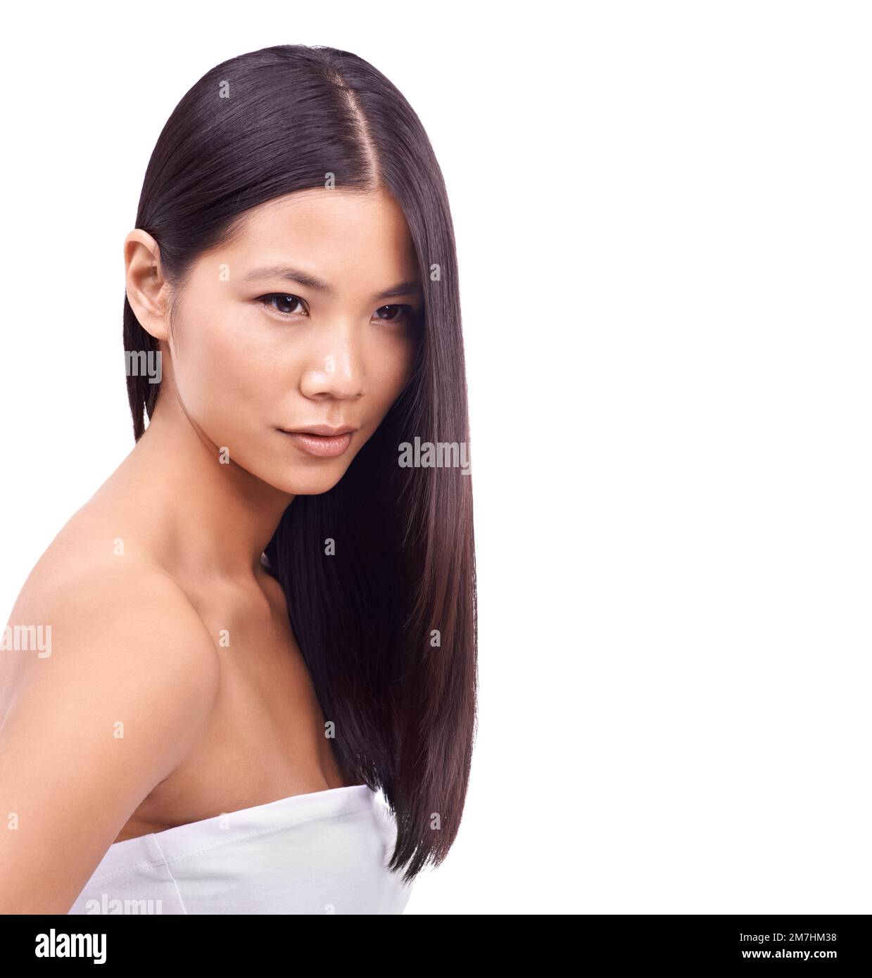 Not just a pretty face. Studio shot of a beautiful young asian woman against a white background. Stock Photo