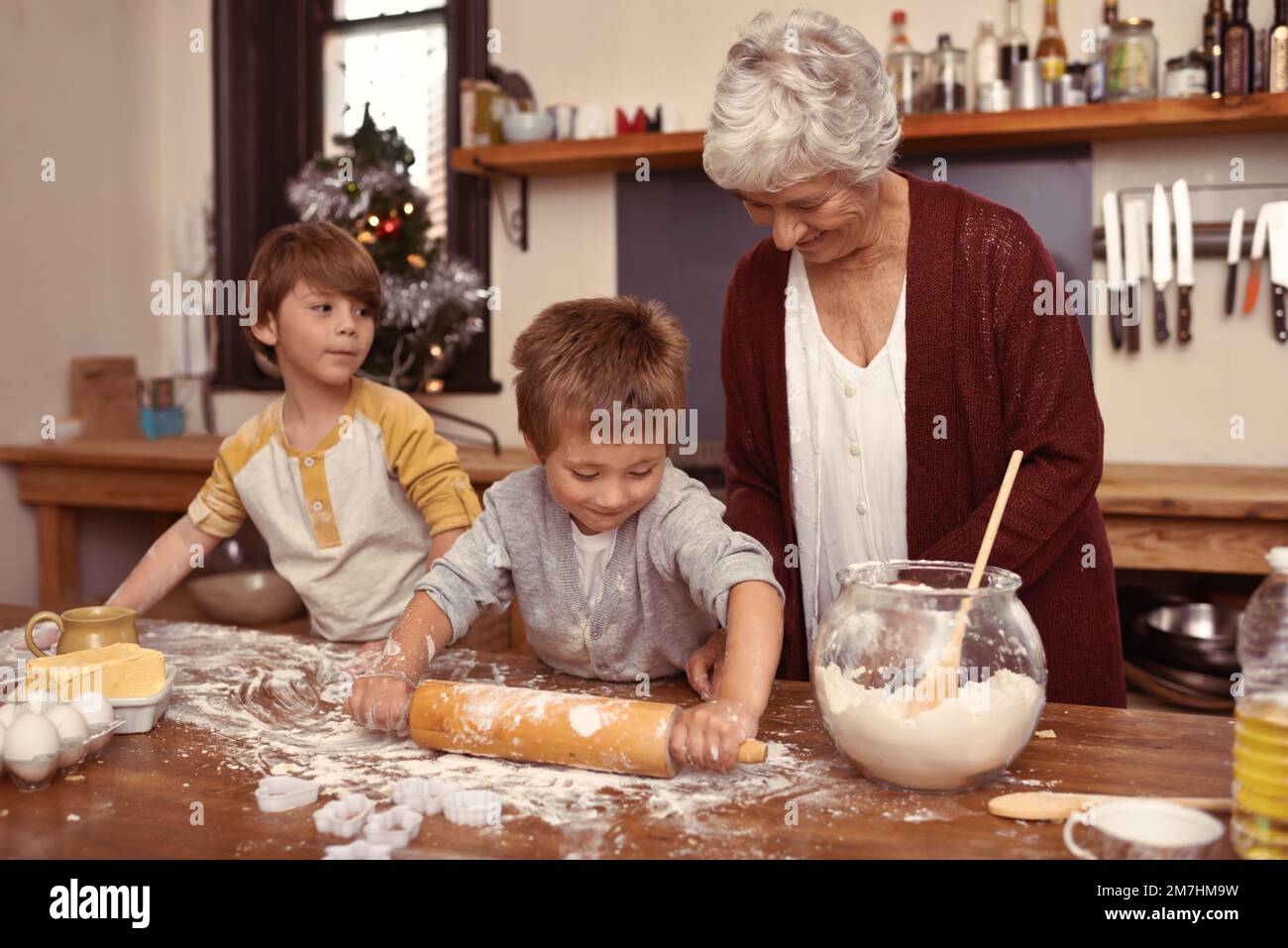 Grannys little bakers. Two cute little boys baking with their