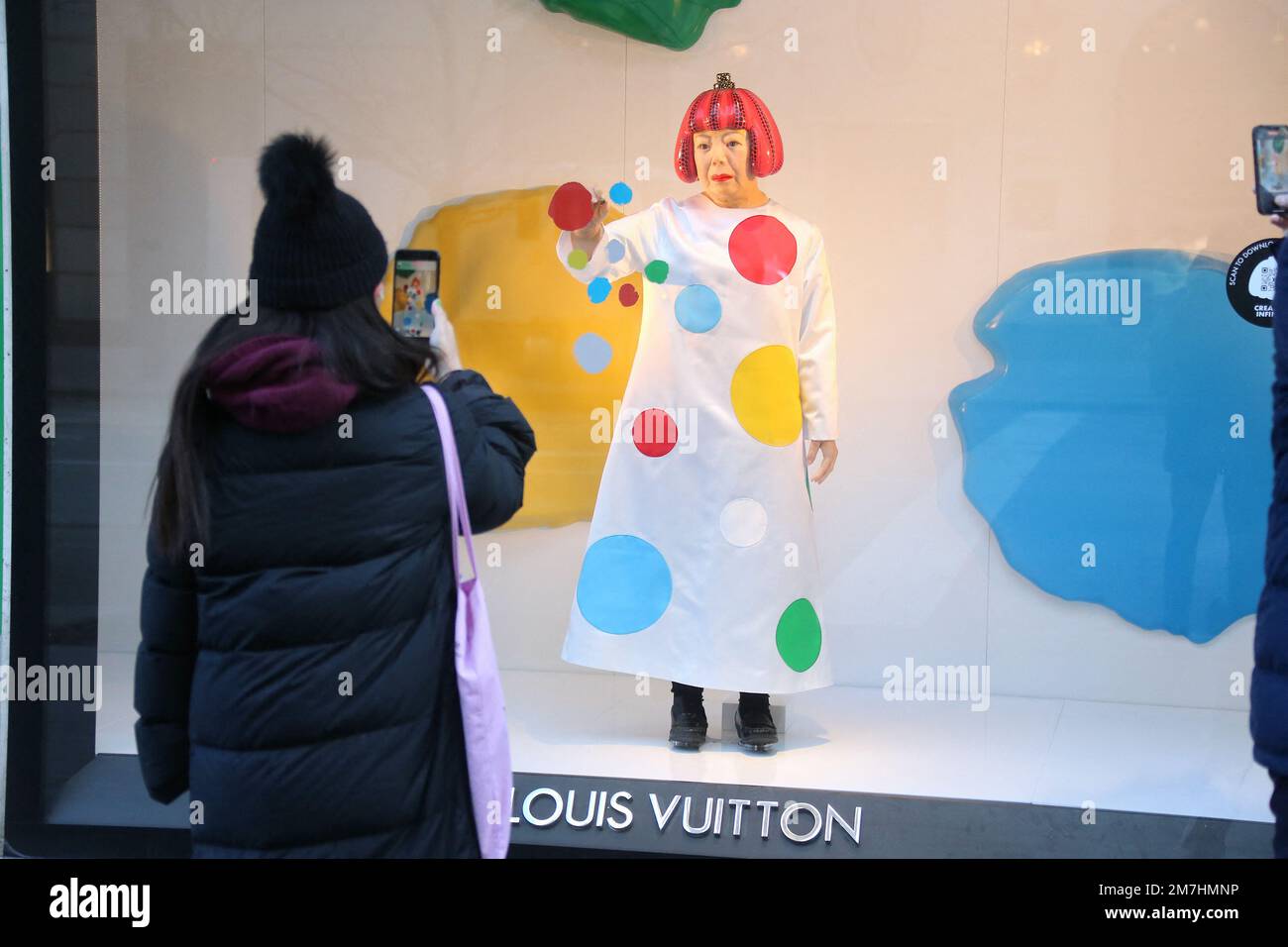 A realistic robot of Japanese artist Yayoi Kusama in the window of