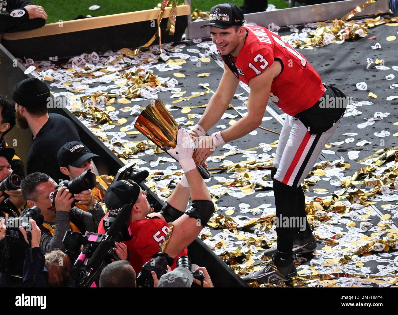 Inglewood, United States. 09th Jan, 2023. Georgia quarterback Stetson Bennett reaches for the National College Football Championship Trophy after the Bulldogs defeated the TCU Horned Frogs 65-7 in the 2023 NCAA College Football National Championship at SoFi Stadium in Inglewood, California, on Monday, January 9, 2023. Photo by Jon SooHoo/UPI Credit: UPI/Alamy Live News Stock Photo