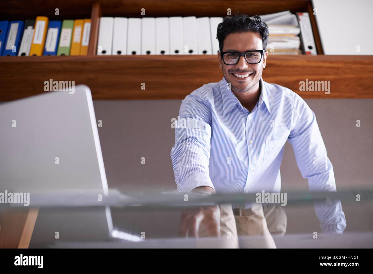 Hes ready for whatever the business world throws at him. a handsome young businessman in his office. Stock Photo
