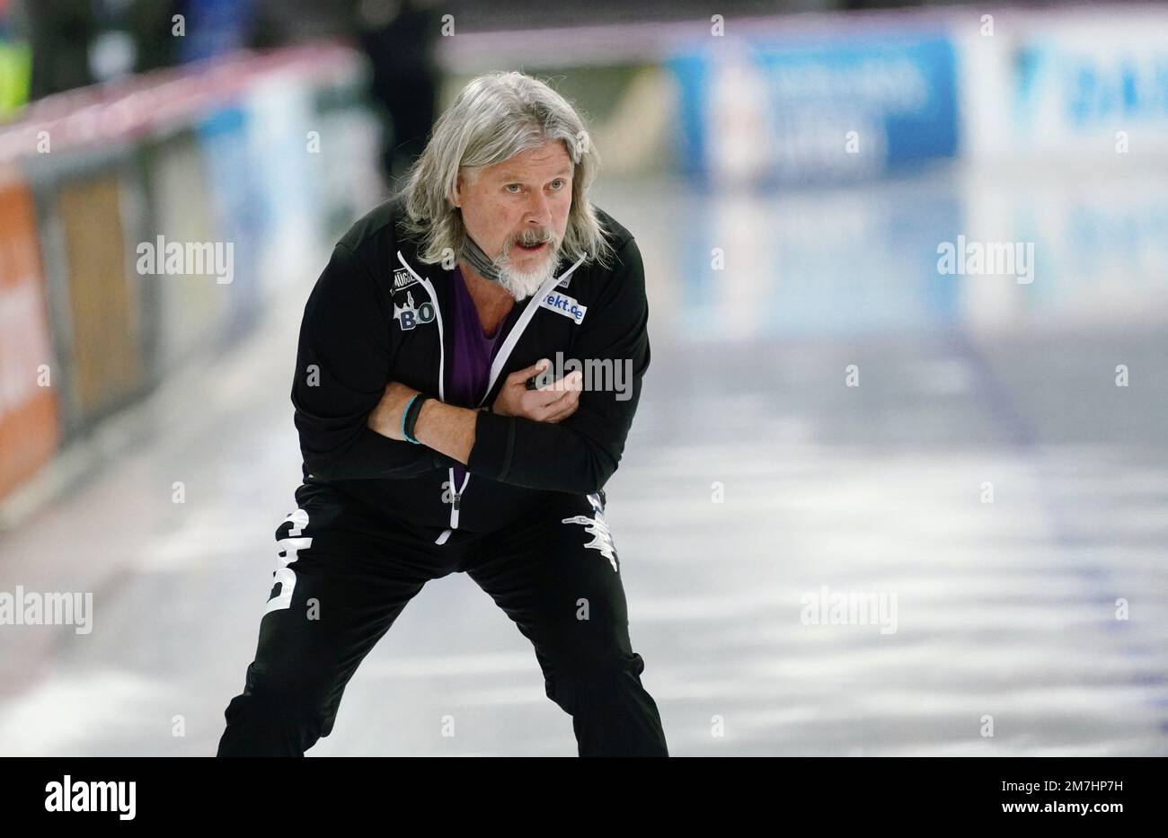 Speed skating coach Peter Mueller of the US coaches Shiho Ishizawa of Japan  as she competes in the women's 5,000 meters race at the World Single  Distances Speed Skating Championships at Thialf