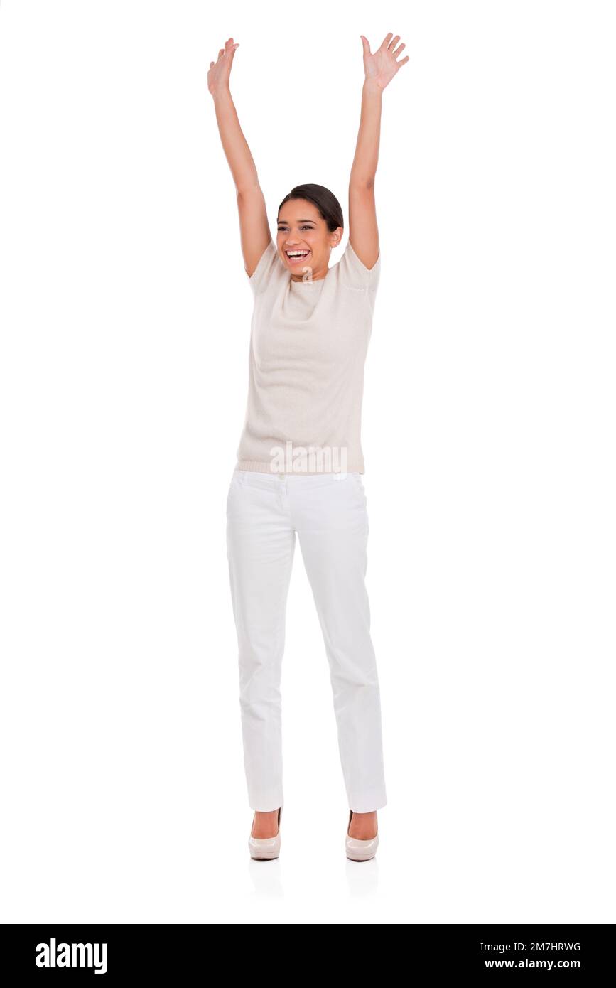 Filled with exuberant joy. A happy woman celebrating with her arms raised. Stock Photo