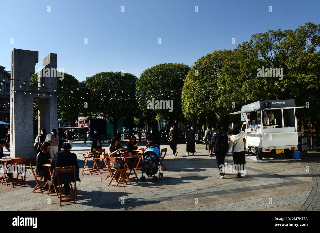 Japanese crowed sitting for lunch and beer at the Yebisu Garden Place in Tokyo, Japan. Stock Photo
